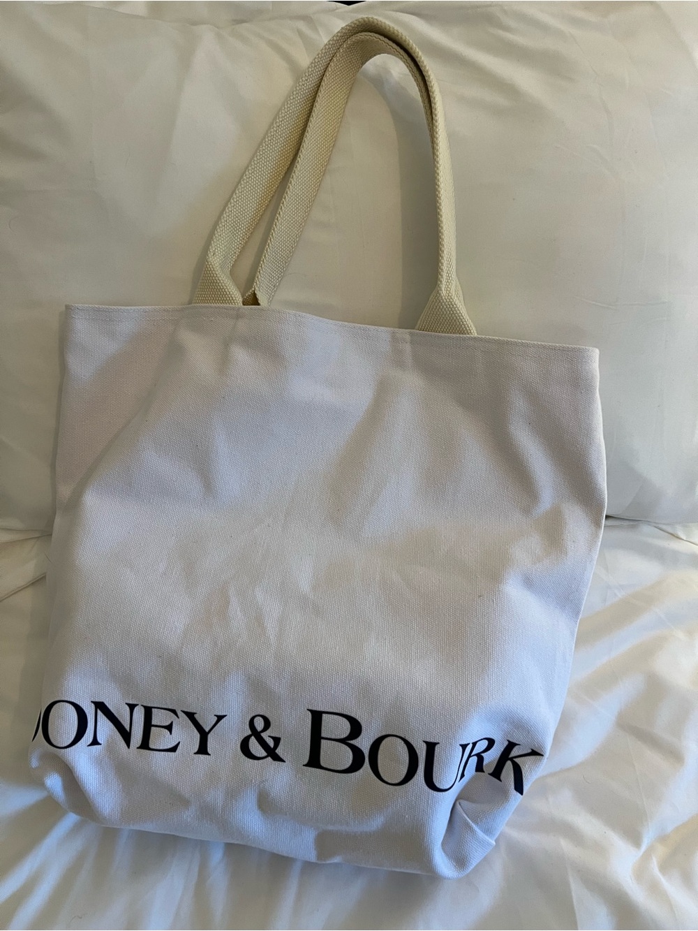 Dooney and Bourke White Canvas Tote with Bold Black Logo and Cream Handles